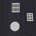Various Stainless Steel Drain Grates And Covers On Dark Textured Surface