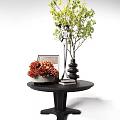 Other Decor On Black Table With Orange Pinecones Photo Frame Silver Sculpture And Green Plant