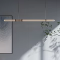Modern Interior Lighting Combination With Linear Pendant Lights Wall Art And Plant Shadows