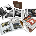 Open Books and Magazines Showcasing Varied Scenic Photos Interior Designs and Artwork
