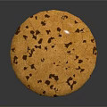 Golden Round Cookie with Dark Brown Chocolate Chips on Gray Background