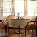 Dining Table Set With Round Marble Top And Four Brown Chairs By Bright Windows With Roller Blinds