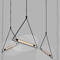 Three Modern Leaf Shaped Glass Pendant Lights With Gold Metal Frames Illuminated On Gray Wall