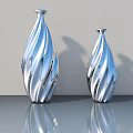 Two Silver Carved Sculpture Vases Featuring Wavy Patterns On Reflective Table 3d model