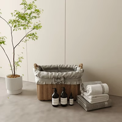 Woven Storage Basket With Gray Lining And Bow In Bathroom With Towels Bottles And Plant 3d model