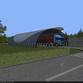 Large Curved Glass Canopy for Truck Entry with Green Lawn and Trees