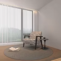 Modern Striped Armchair with Natural Light Round Rug Open Book Small Table Window Mountain View