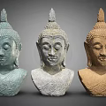 Three Buddha Head Sculptures Intricately Carved With Varied Colors And Classic Features