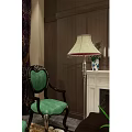 Green Upholstered Chairs And Coffee Table With Stained Glass Window Dark Brown Walls And Fireplace