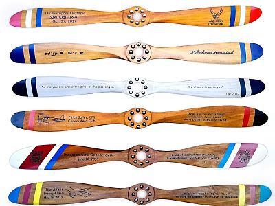 Wooden Propeller Blades With Colorful Stripes And Engravings Displayed Together 3d model
