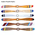 Wooden Propeller Blades With Colorful Stripes And Engravings Displayed Together