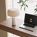 Modern White Table Lamp On Wooden Desk With Laptop Green Leaves And Window Blinds