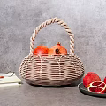 Wicker Basket With Pomegranates Open Book Eyeglasses And Plate With Sliced Pomegranate