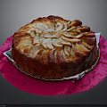 Round Cake Topped With Sliced Pears On Pink Patterned Cloth