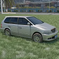 Silver Station Wagon Parked On Green Grassland With Palm Trees And High Rise Buildings