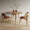 Modern Round Wooden Dining Table With Three Chairs Brown Cushions And Green Plant Decoration
