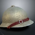 Vintage Metal Helmet With Worn Surface And Red Leather Strap Buckle