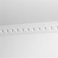 Decorative Architectural Sculpture With Intricate Patterns On White Plaster Cornice