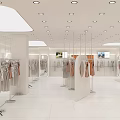 Modern Fashion Retail Counter In Shopping Mall With Mannequins Hanging Clothes And Bright