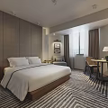 Modern Hotel Guest Room with Comfortable Bed White Bedding Striped Carpet and Writing Desk