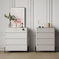 Modern Style White Dressers With Decorative Pieces On Top And Light Walls