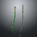 Two Decorative Weapons With Green Yellow Handles And Silver Blades