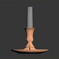 Copper Candlestick Holder With Burned Gray Candle On Reflective Base