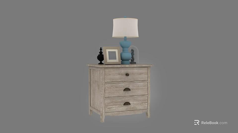 Wooden Bedside Table With Three Drawers Black Handles Blue Lamp White Shade And Photo Frame 3d model 