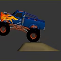 Blue Monster Truck With Flame Graphics And Large Red Tires Jumping Through Dirt Particles