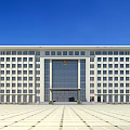 Modern Office Building Exterior With White Facade Large Windows And Spacious Plaza