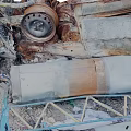 Rusted Metal Scrap Scattered With Pipes Frames And Broken Parts On Sandy Ground