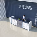 Marble Reception Desk In Welcoming Area With Dark Blue Wall Striped Decoration And Potted Plant