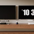 Home Entertainment Setup With Two TV Screens One Showing Digital Clock Display On Wooden Stand