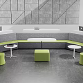 Curved Gray Public Seating With Small Round Tables And Green Stools 3d model