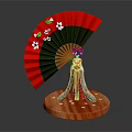 Red Fan With White Flowers Green Leaves Featuring Figurine In Traditional Attire On Wooden Base
