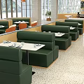 Modern Restaurant Interior With Orange Beige Chairs Marble Tabletops And Green Booth Seats