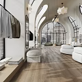Bright Modern High End Clothing Store With Arched Windows Wood Flooring And Cozy Lounge Area