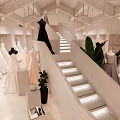 Elegant Bridal Shop Interior With Wedding Dress Displays Staircase And Green Plants