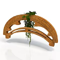 Curved Wooden Structure with Carved Patterns and Green Plants Hanging from Top