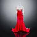 Mannequin Wearing Elegant Red Gradient Gown With Lace Embroidery And Flowing Train Against Dark Background
