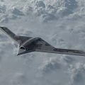 Camouflage Stealth Fighter Jet Flying Through Cloudy Sky With Flying Wing Design
