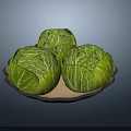 Three Fresh Green Cabbages on a Plate with Vibrant Leaves