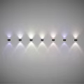 Modern Wall Lamps With Colorful Light Projection Arranged In A Row