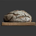Freshly Baked Rustic Bread Loaf on Wooden Cutting Board with Flour Dust