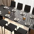 Modern Black Dining Table Set With White Plates Cutlery Wine Glasses And Black Chairs