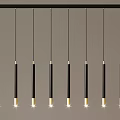 Modern Black and Gold Cylindrical Linear Pendant Lights Mounted on Horizontal Bar Illuminated Design