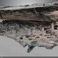 Rocky Cliffside Terrain With Ancient Cave Dwellings Weathered Rock Formations And Historic Ruins