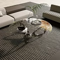 Modern Round Glass Coffee Table In Living Room With Sofa And Green Plant
