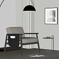 Modern Beige Leisure Chair With Black Armrests Floor Lamp Side Table And Wall Art In Minimalist Space