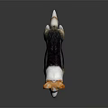 Brown Black and White Dog Figurine Standing on Dark Background with Reflection